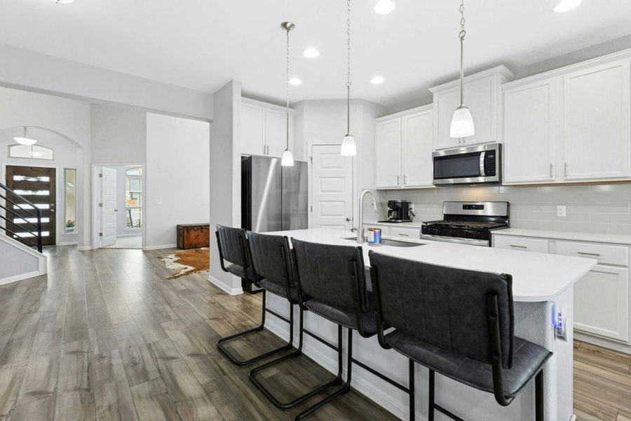 Oversized island is a wonderful spot to entertain. Oversized island is a wonderful spot to entertain.