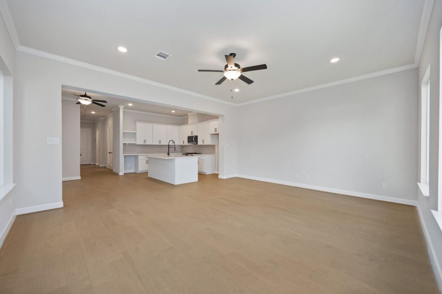 So Much Space to Relax & EntertainThis wide-angle view shows off the magic of first-floor living—kitchen, dining, and living all connected in one beautifully cohesive space. So Much Space to Relax & EntertainThis wide-angle view shows off the magic of first-floor living—kitchen, dining, and living all connected in one beautifully cohesive space.