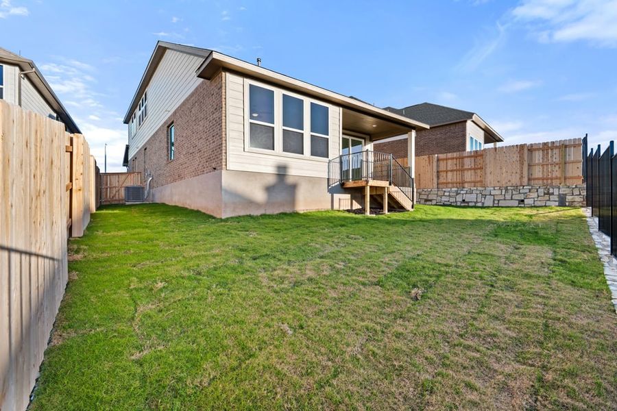 Exterior details and patio area of a home in Terrace Collection at Lariat, Liberty Hill (Image 28).