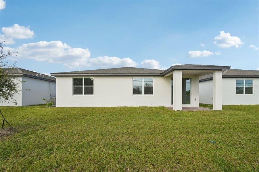 Exterior details and patio area of a home in The Meadow at Crossprairie, St. Cloud (Image 19).