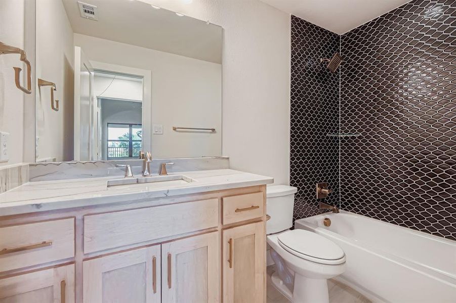 Full bathroom featuring vanity and bathtub / shower combination