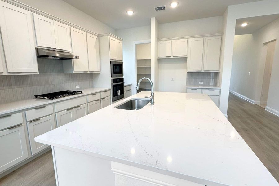 Furnished interior view inside a new home in Bluffview Reserve, Leander (Image 10).