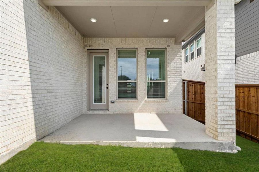 Exterior details and patio area of a home in The Villages of Hurricane Creek, Anna (Image 4).