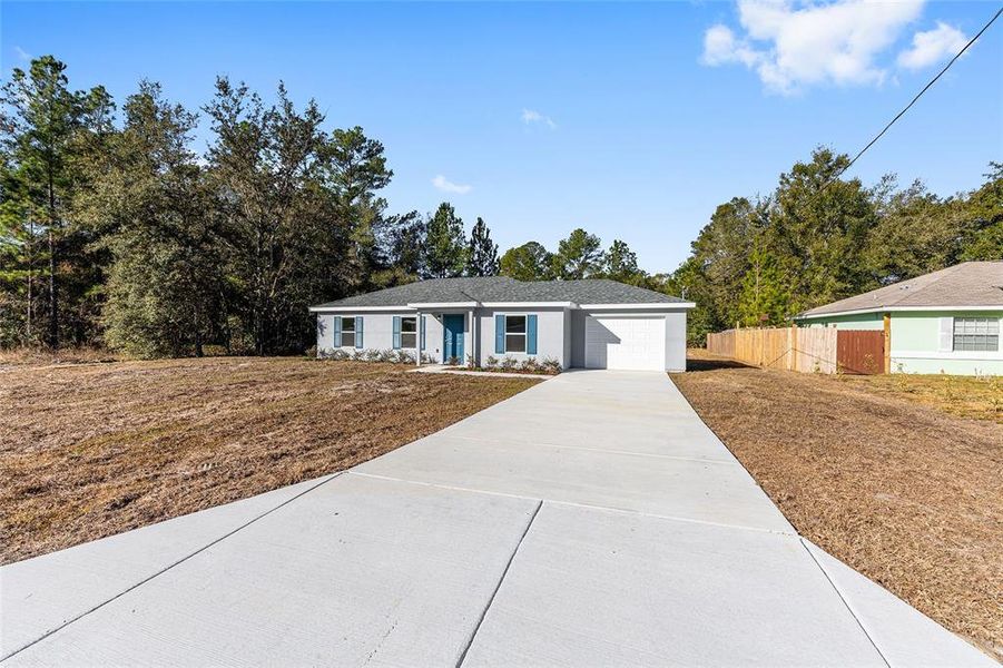 Front exterior of a new home in , Ocala, FL, highlighting curb appeal (Image 18).