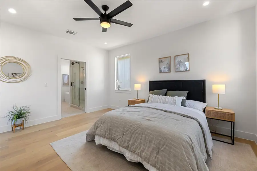 Bathroom featuring vanity, ceiling fan, and hardwood / wood-style floors