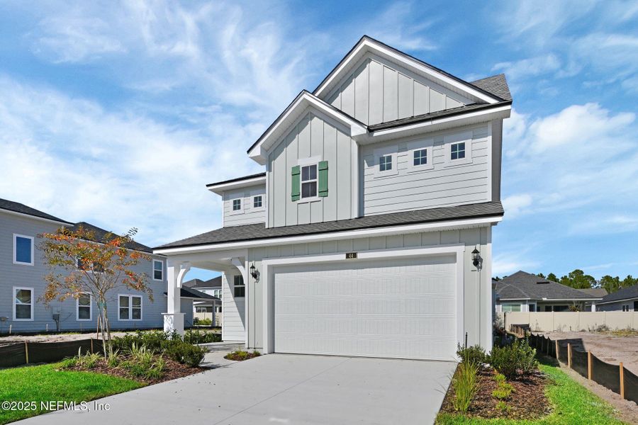Front exterior of a new home in Seabrook Village at Nocatee, Ponte Vedra, FL, highlighting curb appeal (Image 21).