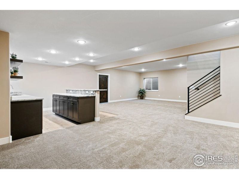 Pool table, Rec room? - plenty of room for everything in this expansive finished portion of the basement. Need more space - that far door leads to your utility room / unfinished portion of the basement; another 700 SF for future expansion.