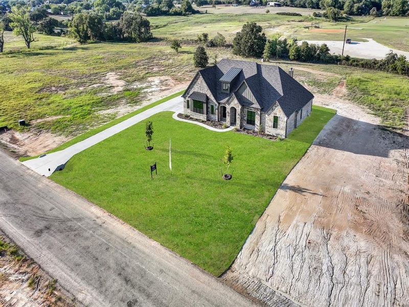 Front exterior of a new home in , Weatherford, TX, highlighting curb appeal (Image 26).