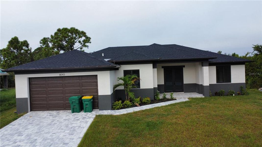 Front exterior of a new home in , Port Charlotte, FL, highlighting curb appeal (Image 12). Front exterior of a new home in , Port Charlotte, FL, highlighting curb appeal (Image 12).