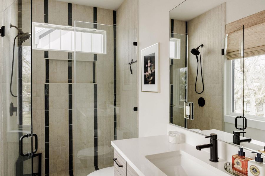 Full bathroom with a stall shower and vanity