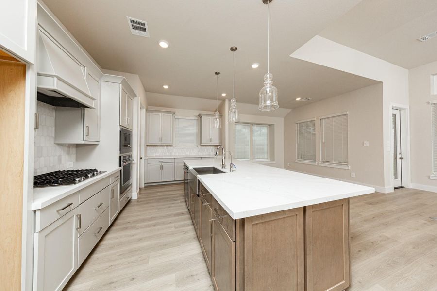 Discover the perfect blend of style and function in this modern kitchen, ready for your next culinary adventure. Equipped with high-end, stainless steel appliances, including a gas cooktop, built-in oven, and microwave. Discover the perfect blend of style and function in this modern kitchen, ready for your next culinary adventure. Equipped with high-end, stainless steel appliances, including a gas cooktop, built-in oven, and microwave.