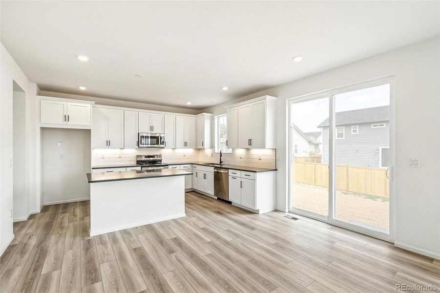 Furnished interior view inside a new home in Windsong, Thornton (Image 11).