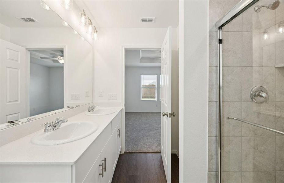 Owner's private bath with double vanity