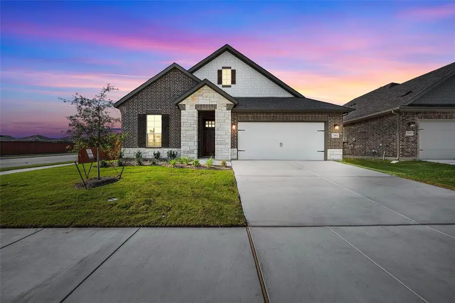 Front exterior of a new home in Northstar, Haslet, TX, highlighting curb appeal (Image 1).