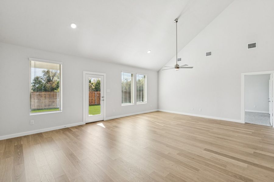 Dining and Living Rooms in the Winters home plan by Trophy Signature Homes – REPRESENTATIVE PHOTO