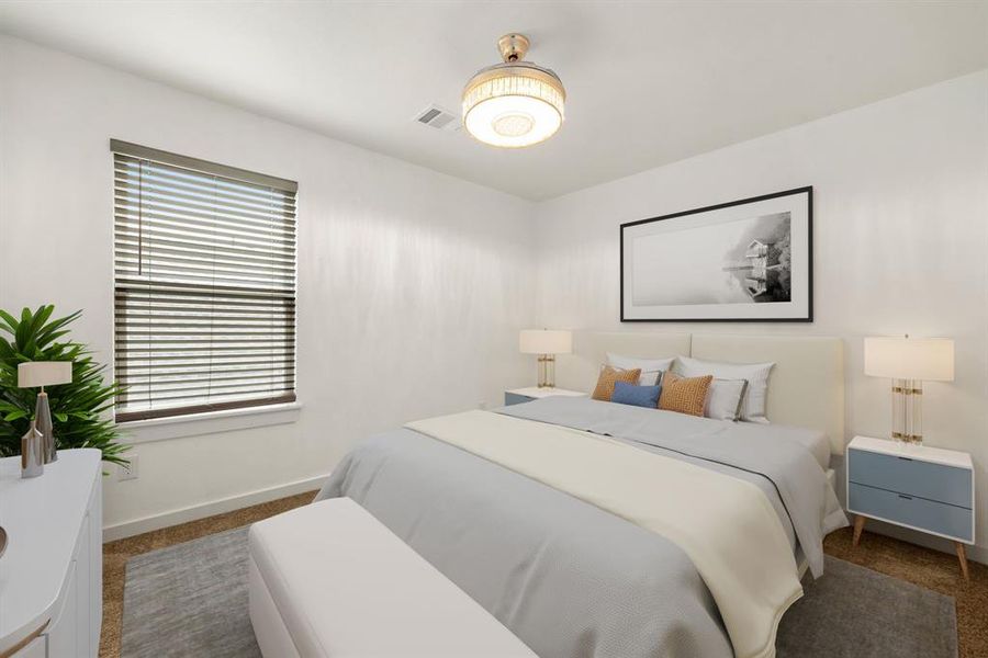 Secondary bedroom features plush carpet, neutral paint, custom lighting and a large window with privacy blinds.