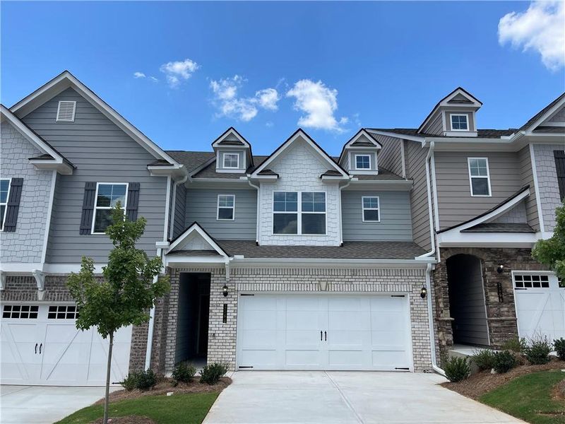 Front exterior of a new home in Porter Reserve, Decatur, GA, highlighting curb appeal (Image 1). Front exterior of a new home in Porter Reserve, Decatur, GA, highlighting curb appeal (Image 1).