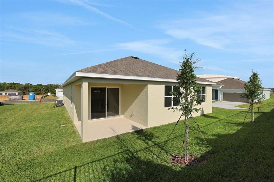 Exterior details and patio area of a home in Seaport Village, Tavares (Image 3).