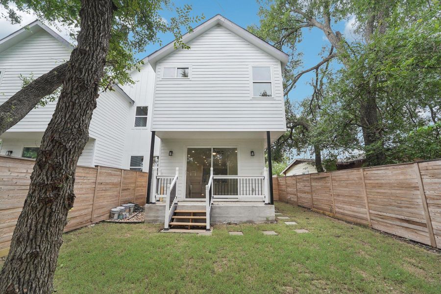 Back of house backyard and covered porch Back of house backyard and covered porch