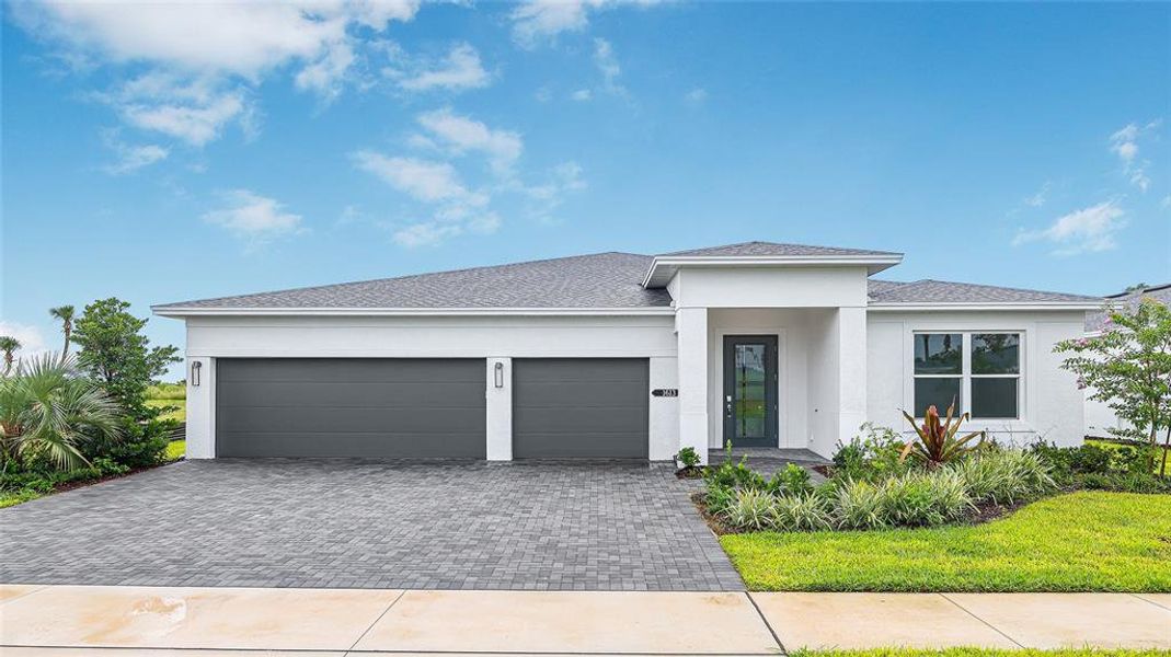 Front exterior of a new home in Cresswind at Lake Harris, Tavares, FL, highlighting curb appeal (Image 2).