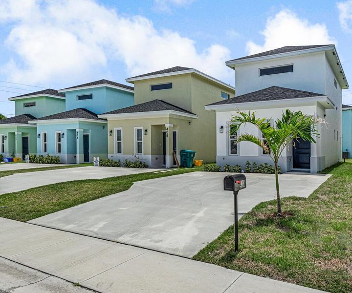 Front exterior of a new home in , Boynton Beach, FL, highlighting curb appeal (Image 1).