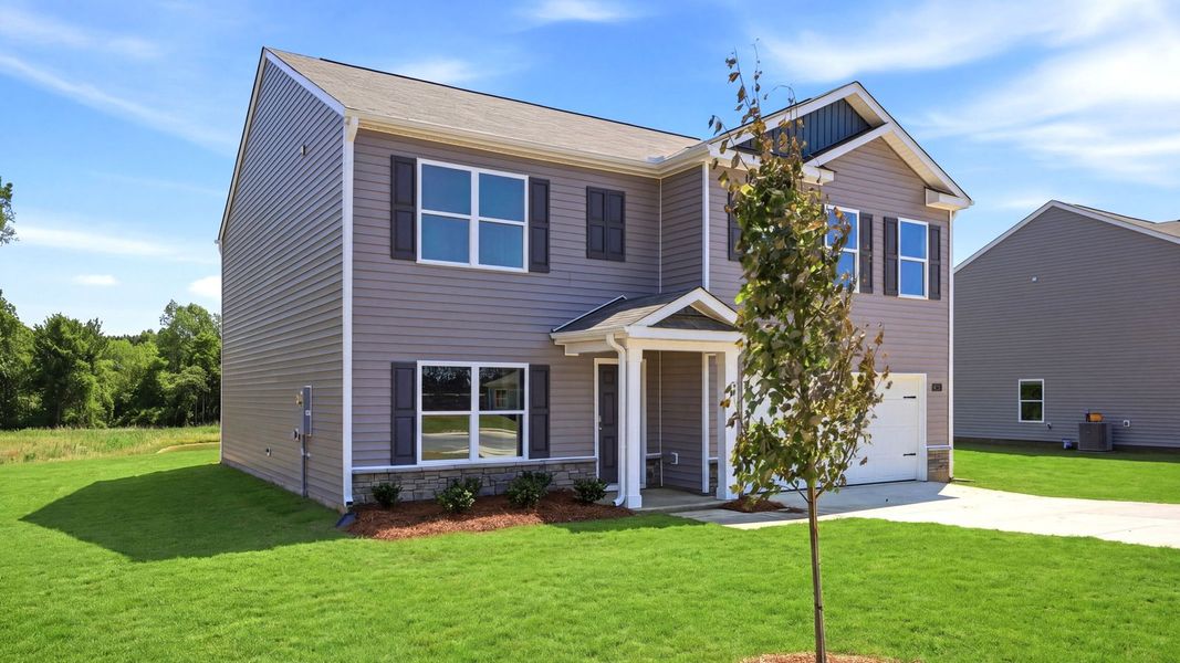 Front exterior of a new home in Bynum Farms, Farmville, NC, highlighting curb appeal (Image 21).