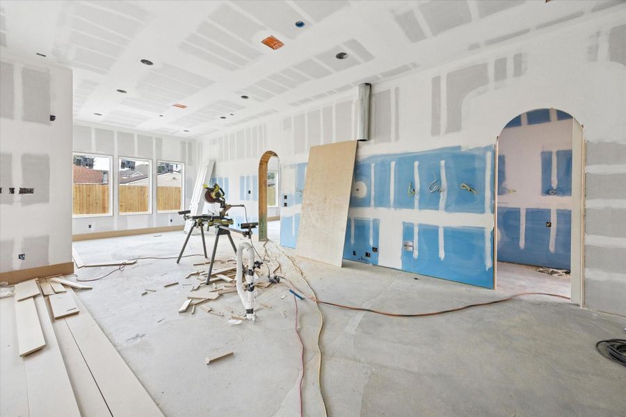 Positioned at the heart of the home, the kitchen is designed around an impressive 11 foot island with a clean, uninterrupted surface ideal for prep, serving, and entertaining. The layout accommodates a full suite of Thermador appliances, including a 48 inch refrigerator, along with designer plumbing fixtures and a pot filler. A separate prep kitchen and pantry enhance functionality while maintaining a refined, streamlined main kitchen aesthetic.