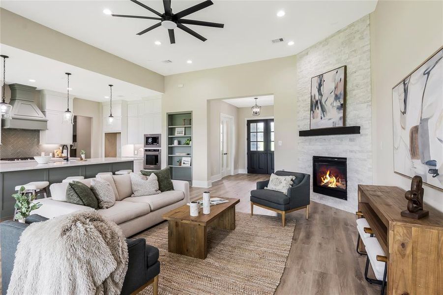 This inviting living space features an open concept modern kitchen with an island, and stylish finishes. This inviting living space features an open concept modern kitchen with an island, and stylish finishes.