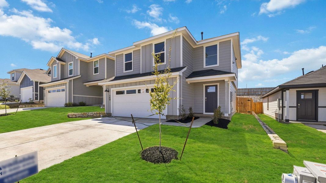Front exterior of a new home in Wayside, Uhland, TX, highlighting curb appeal (Image 15).