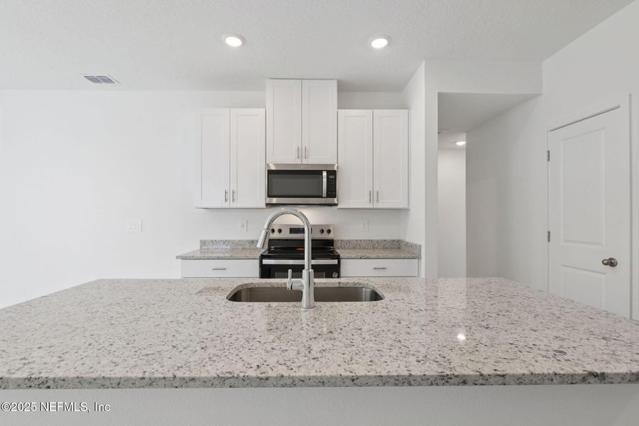 Furnished interior view inside a new home in Flagler Village - Classic Series, Palm Coast (Image 13).