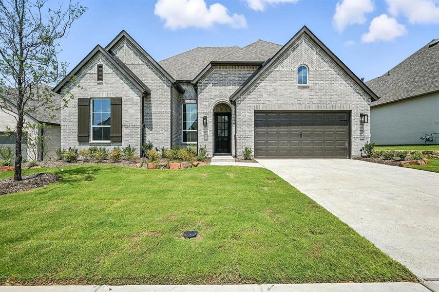 Front exterior of a new home in Thompson Farms: 60ft. lots, Van Alstyne, TX, highlighting curb appeal (Image 22). Front exterior of a new home in Thompson Farms: 60ft. lots, Van Alstyne, TX, highlighting curb appeal (Image 22).