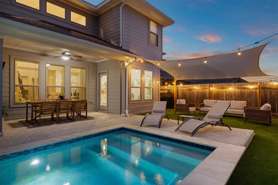 The surrounding layout keeps movement easy whether you are swimming, lounging, or grilling
