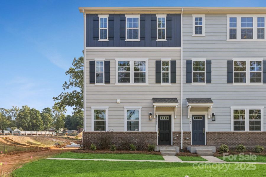 Front exterior of a new home in , Huntersville, NC, highlighting curb appeal (Image 1).