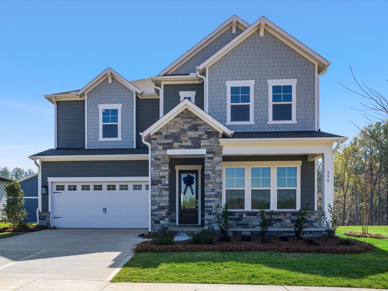 Front exterior of a new home in Hardy Pond, Rock Hill, SC, highlighting curb appeal (Image 1). Front exterior of a new home in Hardy Pond, Rock Hill, SC, highlighting curb appeal (Image 1).