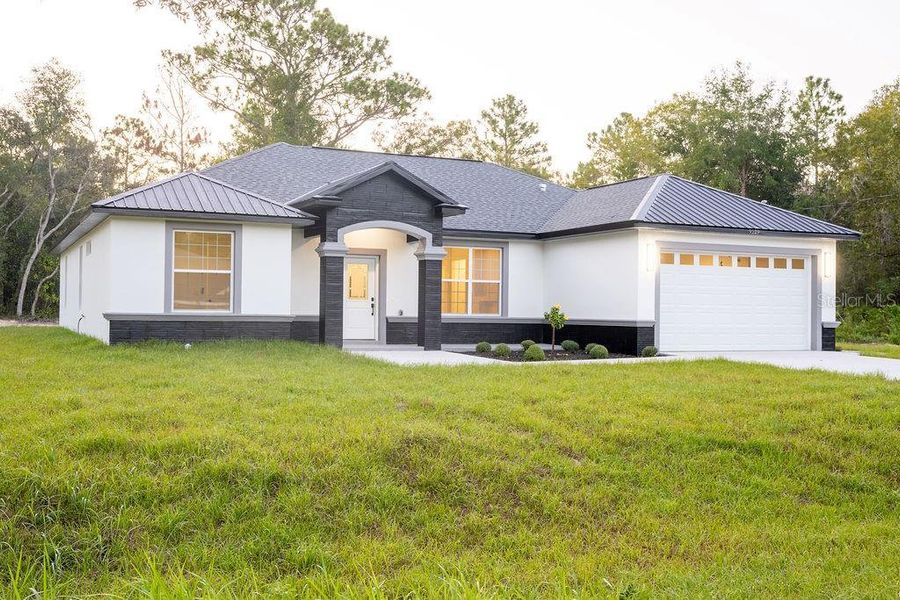 Front exterior of a new home in , Dunnellon, FL, highlighting curb appeal (Image 28). Front exterior of a new home in , Dunnellon, FL, highlighting curb appeal (Image 28).