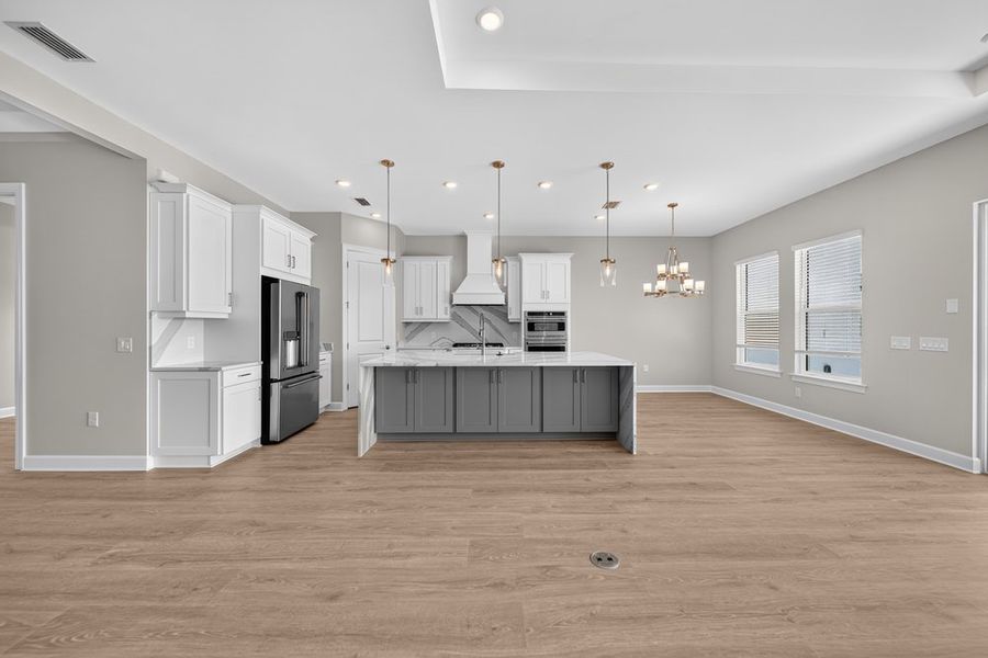 Furnished interior view inside a new home in Esplanade by the Islands, Naples (Image 7).