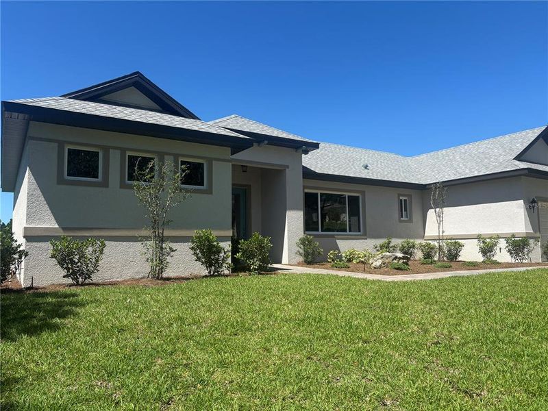 Front exterior of a new home in , Lady Lake, FL, highlighting curb appeal (Image 22).
