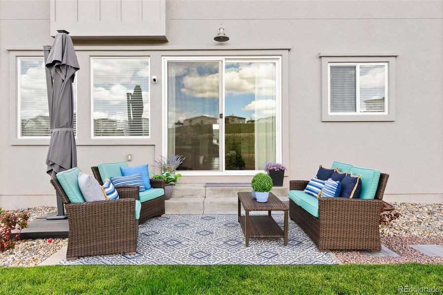 Back patio where you can indulge in relaxed conversation-- RARE FIND to have open space and no neighbors right behind, no neighbors on one side.