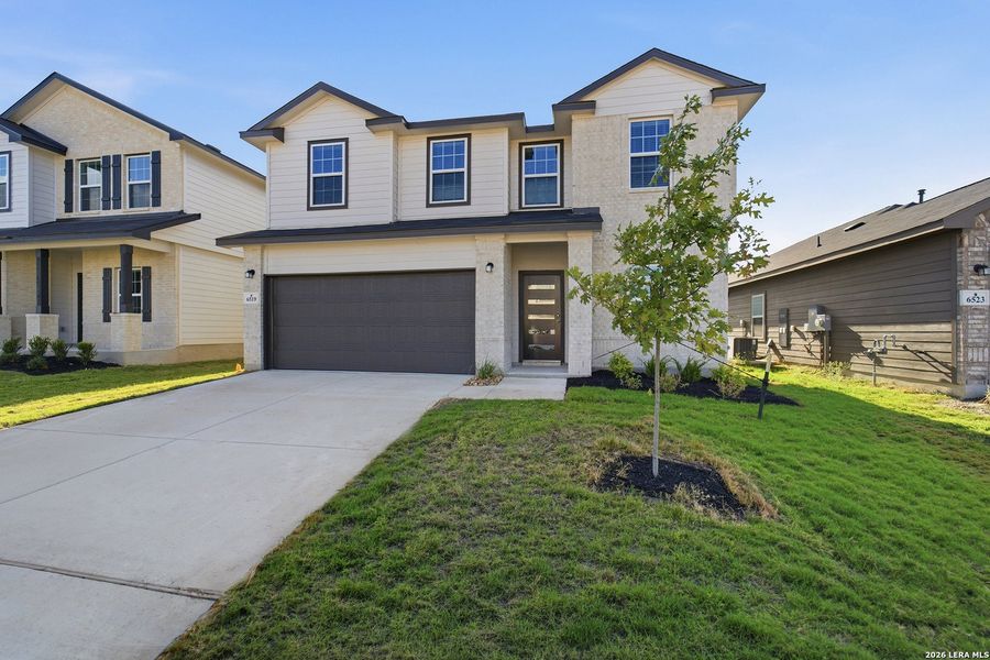 Front exterior of a new home in Morgan Meadows, San Antonio, TX, highlighting curb appeal (Image 2).