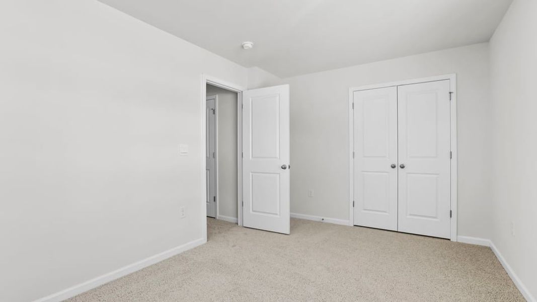 Spacious, unfurnished interior of a new home in Village Grove, Greenville (Image 28).