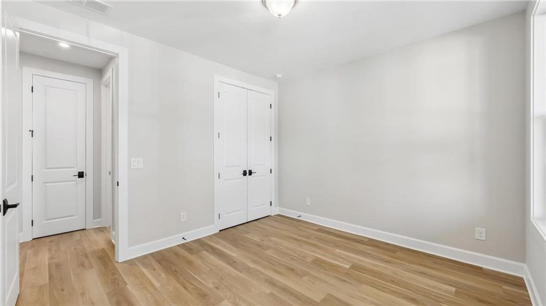Spacious, unfurnished interior of a new home in Cresswind Georgia at Twin Lakes, Hoschton (Image 32).