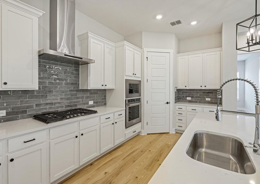 The kitchen has a gorgeous tile backsplash. The kitchen has a gorgeous tile backsplash.