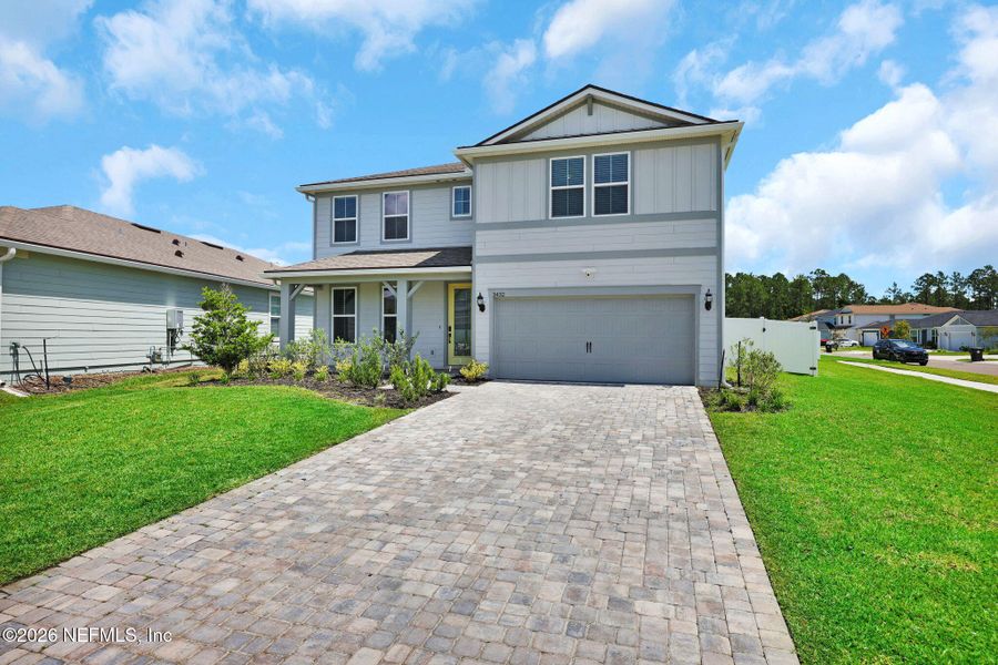 Front exterior of a new home in Double Branch, Middleburg, FL, highlighting curb appeal (Image 30). Front exterior of a new home in Double Branch, Middleburg, FL, highlighting curb appeal (Image 30).