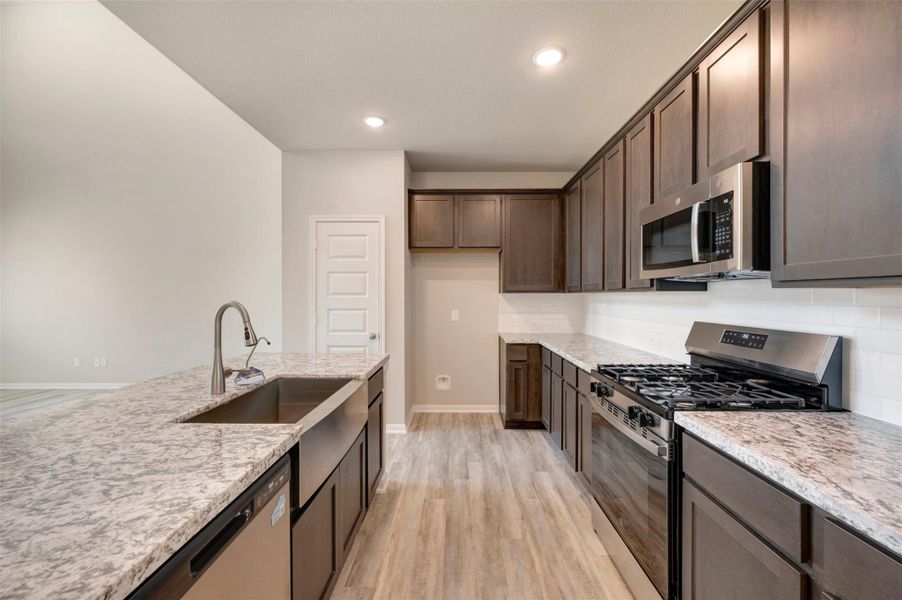 Lovely kitchen with large island (*Photo not of actual home and used for illustration purposes only.)