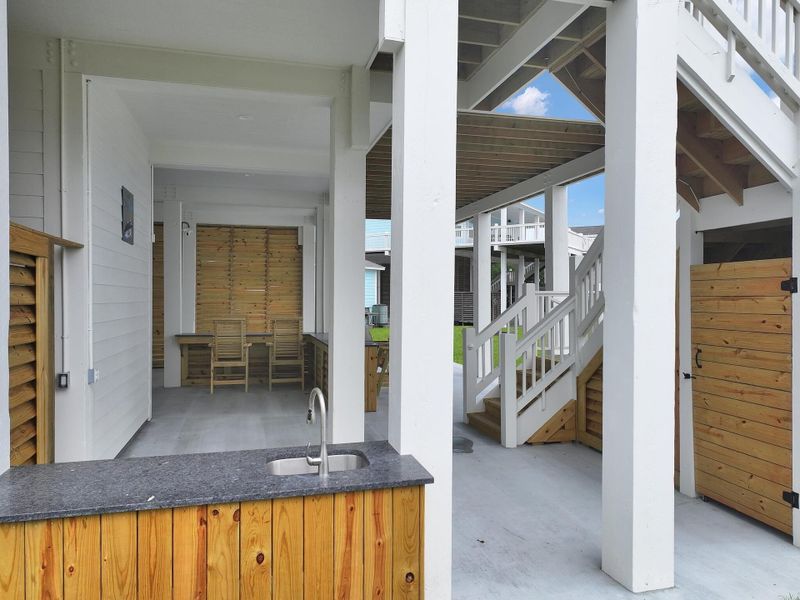 View from the fish cleaning station to the bar area and stairway to the backside of house