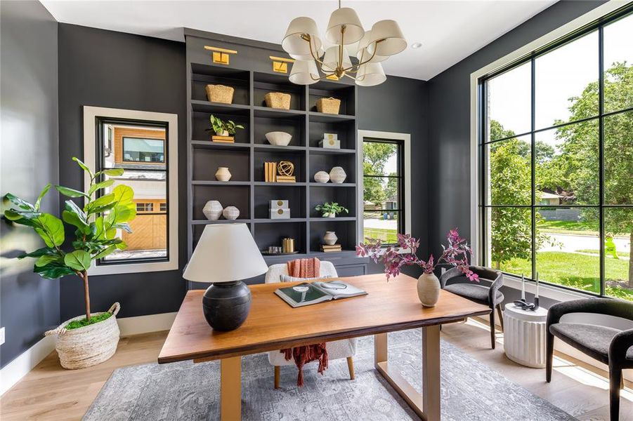 Office featuring an inviting chandelier, plenty of natural light, and light hardwood / wood-style floors