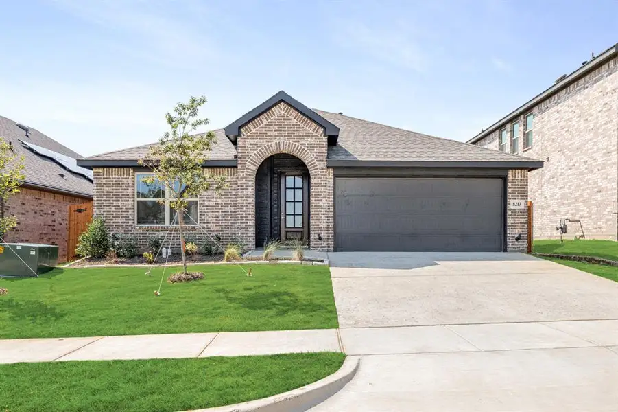 Front exterior of a new home in Godley Ranch Elements, Godley, TX, highlighting curb appeal (Image 2).