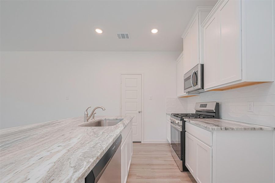 Furnished interior view inside a new home in Sunterra, Katy (Image 7).