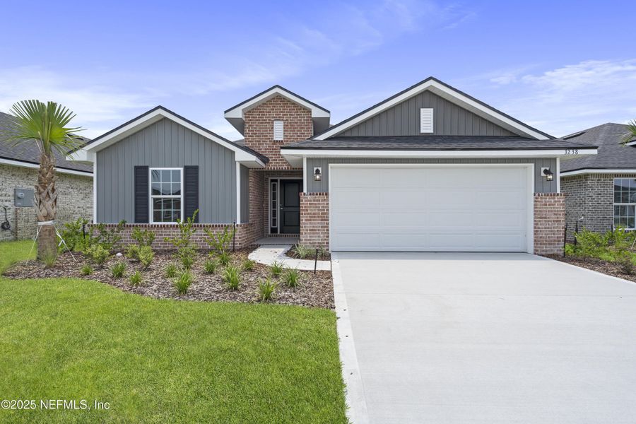 Front exterior of a new home in Shadow Crest at Rolling Hills, Green Cove Springs, FL, highlighting curb appeal (Image 13). Front exterior of a new home in Shadow Crest at Rolling Hills, Green Cove Springs, FL, highlighting curb appeal (Image 13).