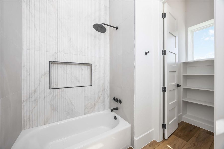 Consistent shower wall detailing throughout the home for a clean, cohesive look.